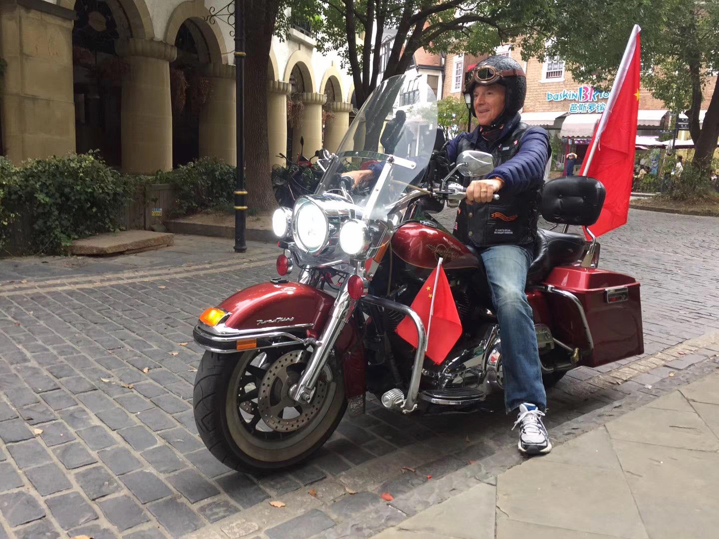 Jim Cathcart with the Road King motorcycle in China