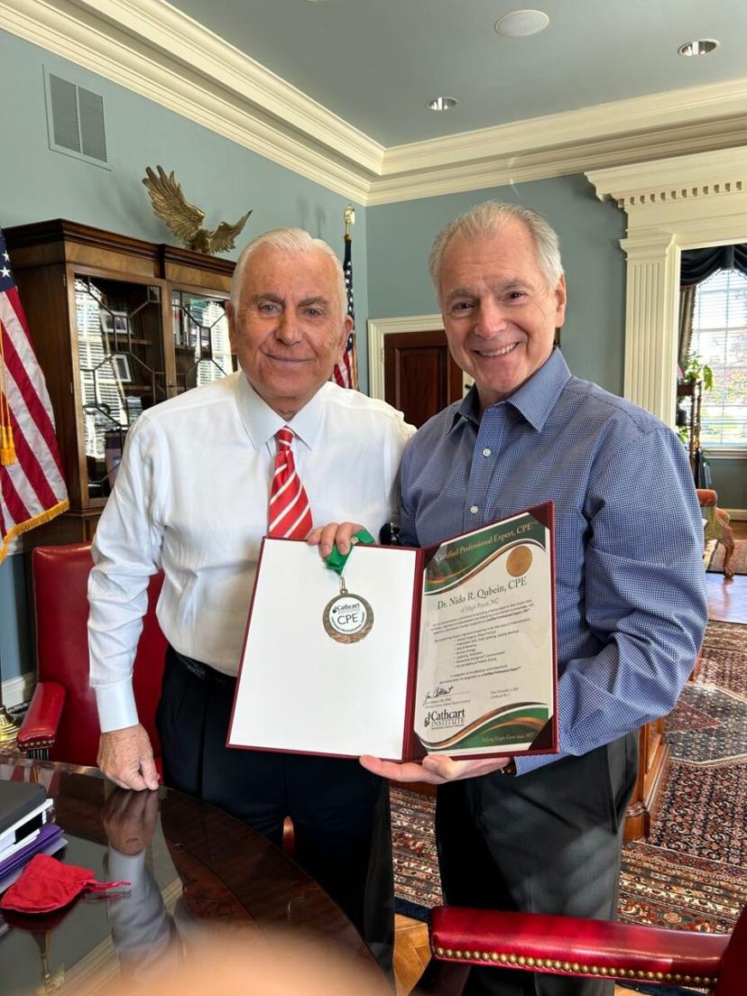 Jim Cathcart presenting the CPE to Nido Qubein