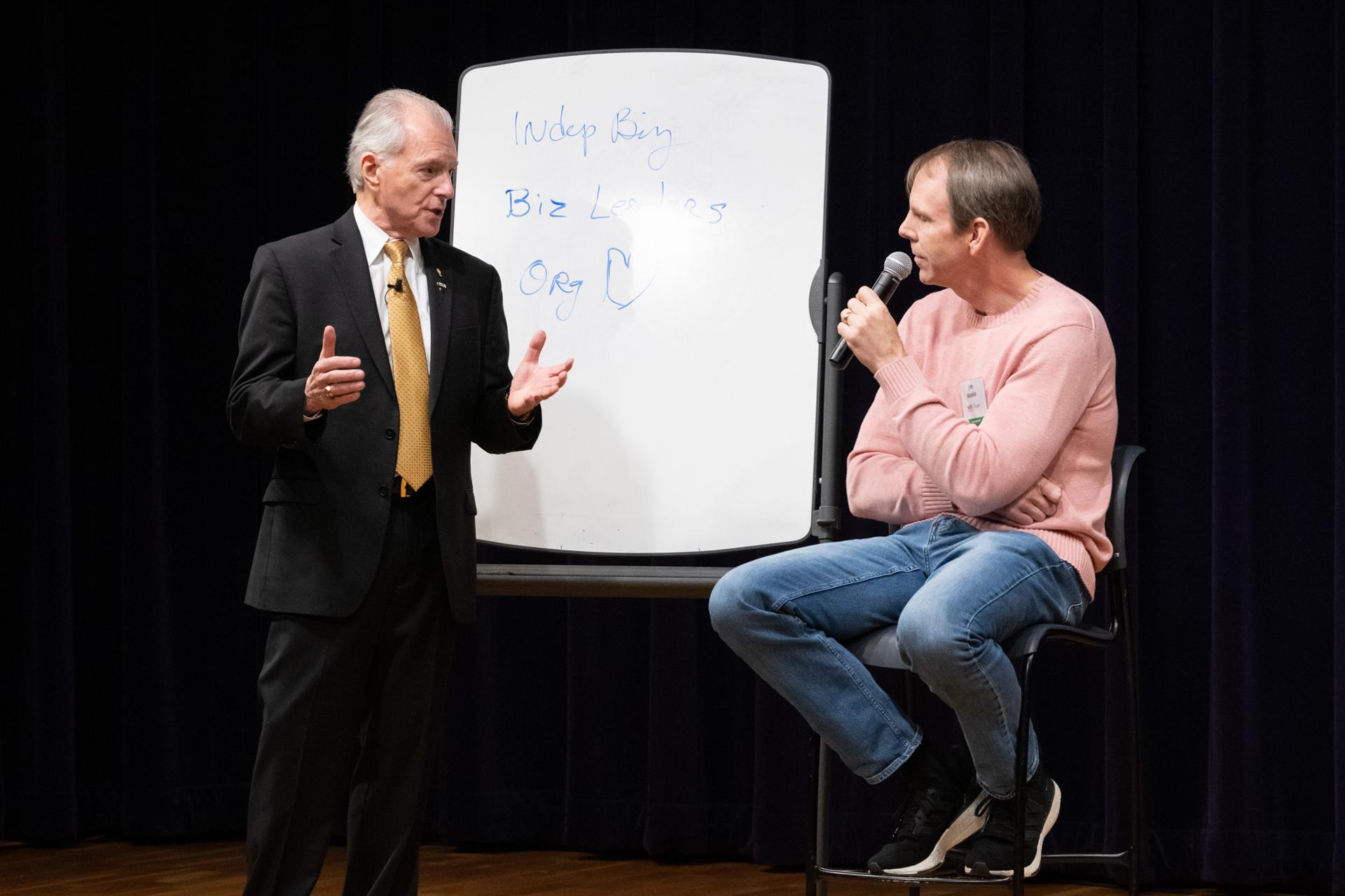 Jim Cathcart coaching a professional at the whiteboard during a Going Pro session