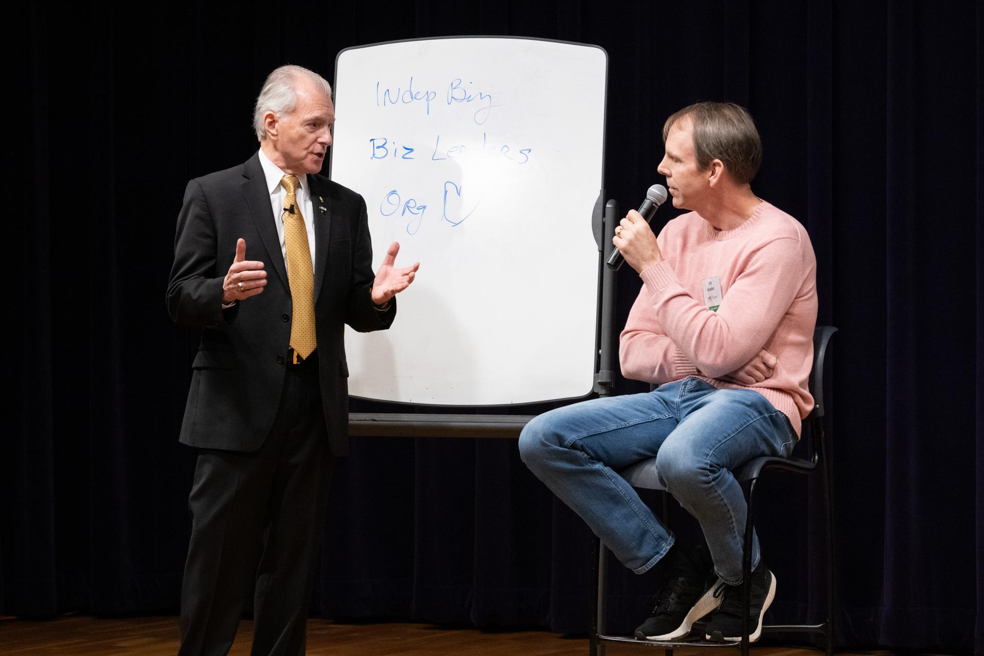 Jim Cathcart coaching a professional at the whiteboard during a Going Pro session