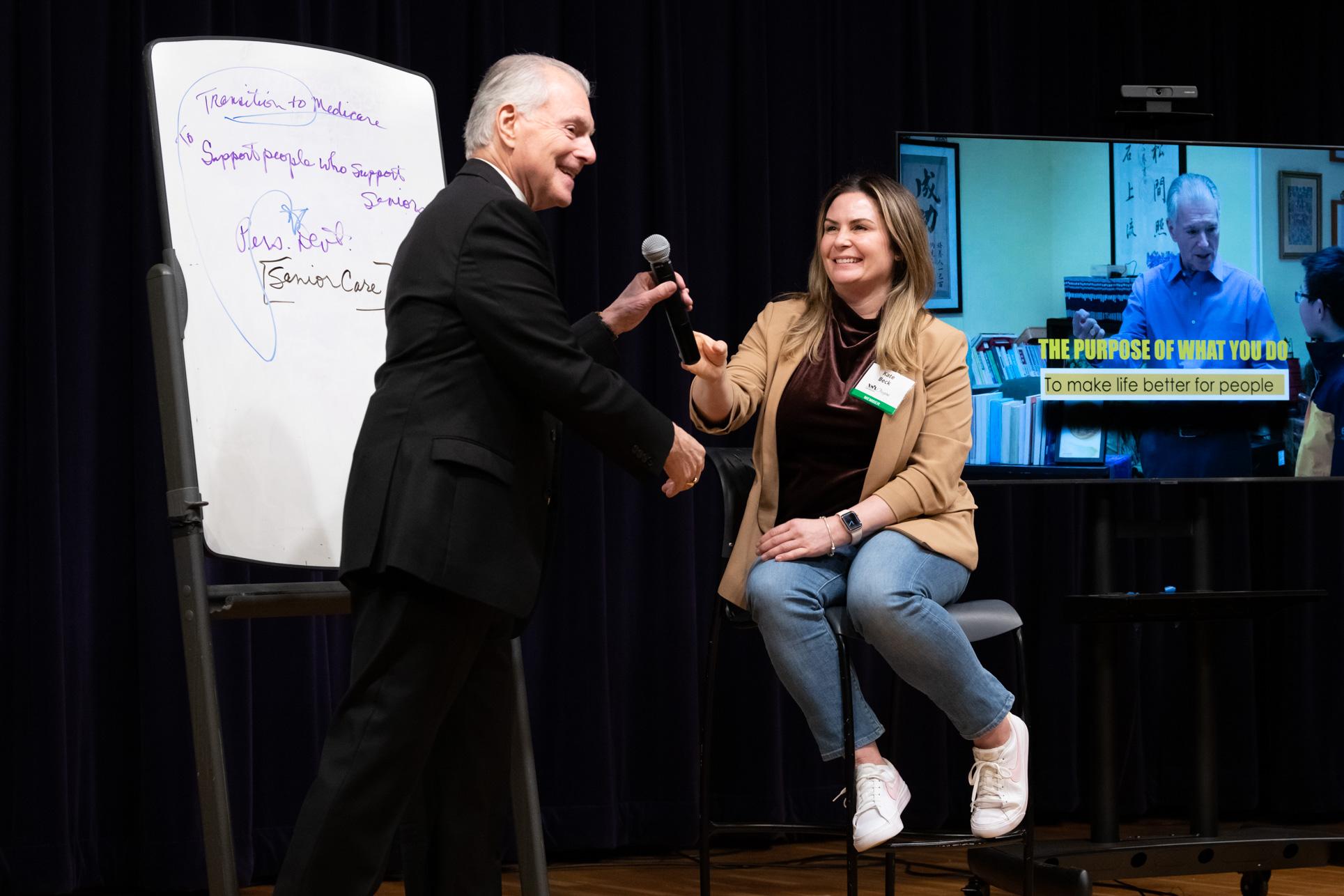 Jim Cathcart mentoring a professional one-on-one at the Summit