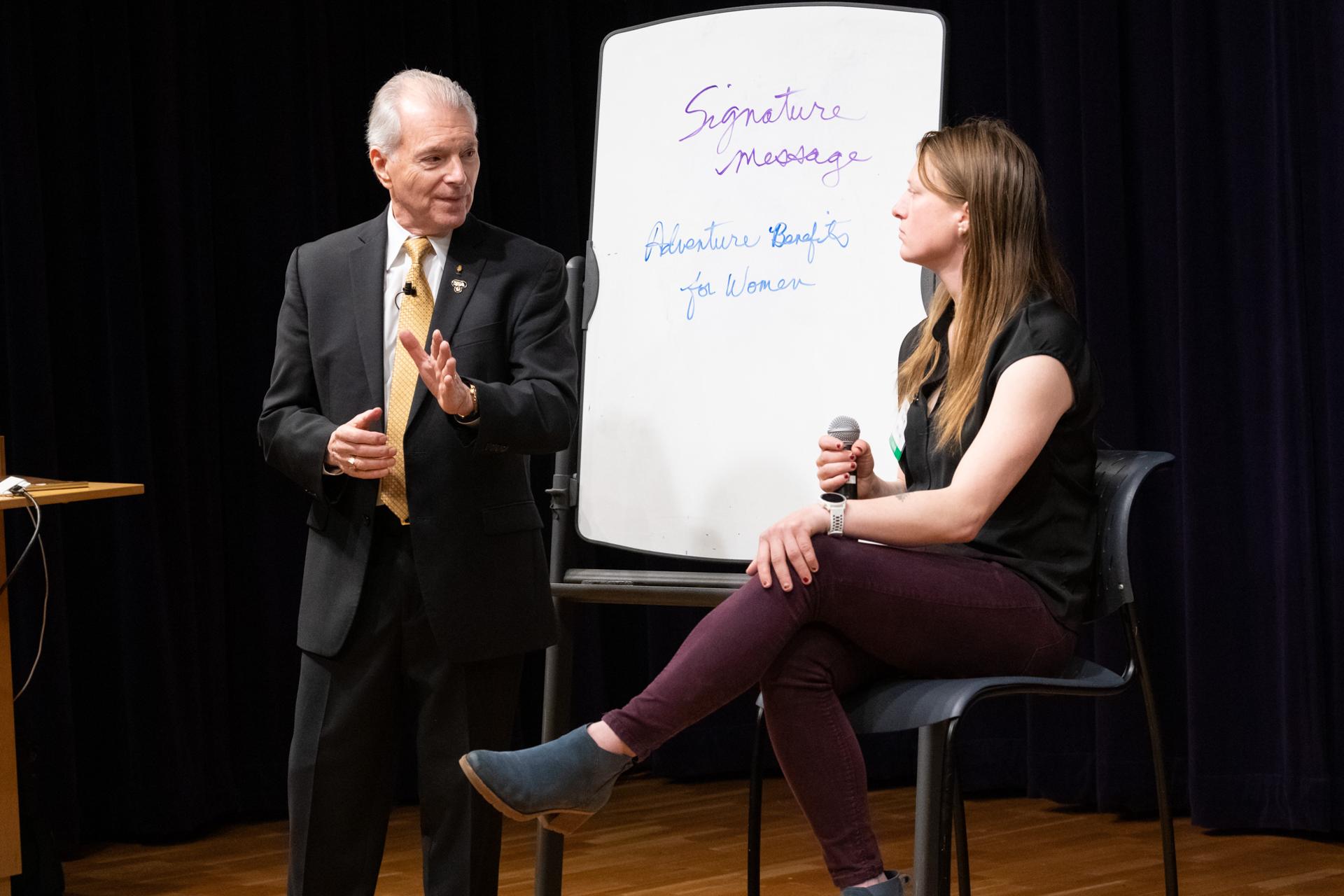 Jim Cathcart helping a professional develop her signature message