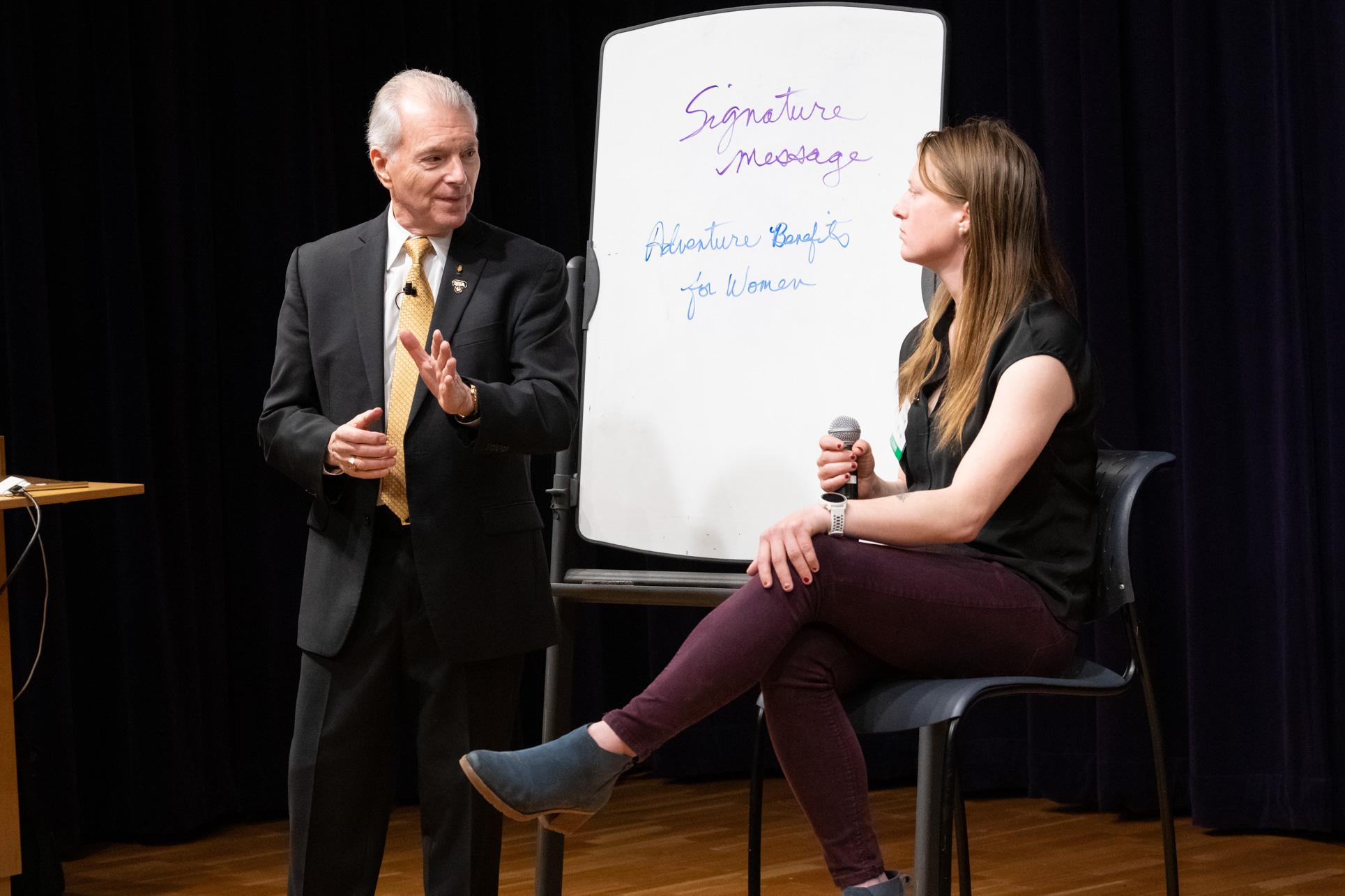 Jim Cathcart helping a professional develop her signature message