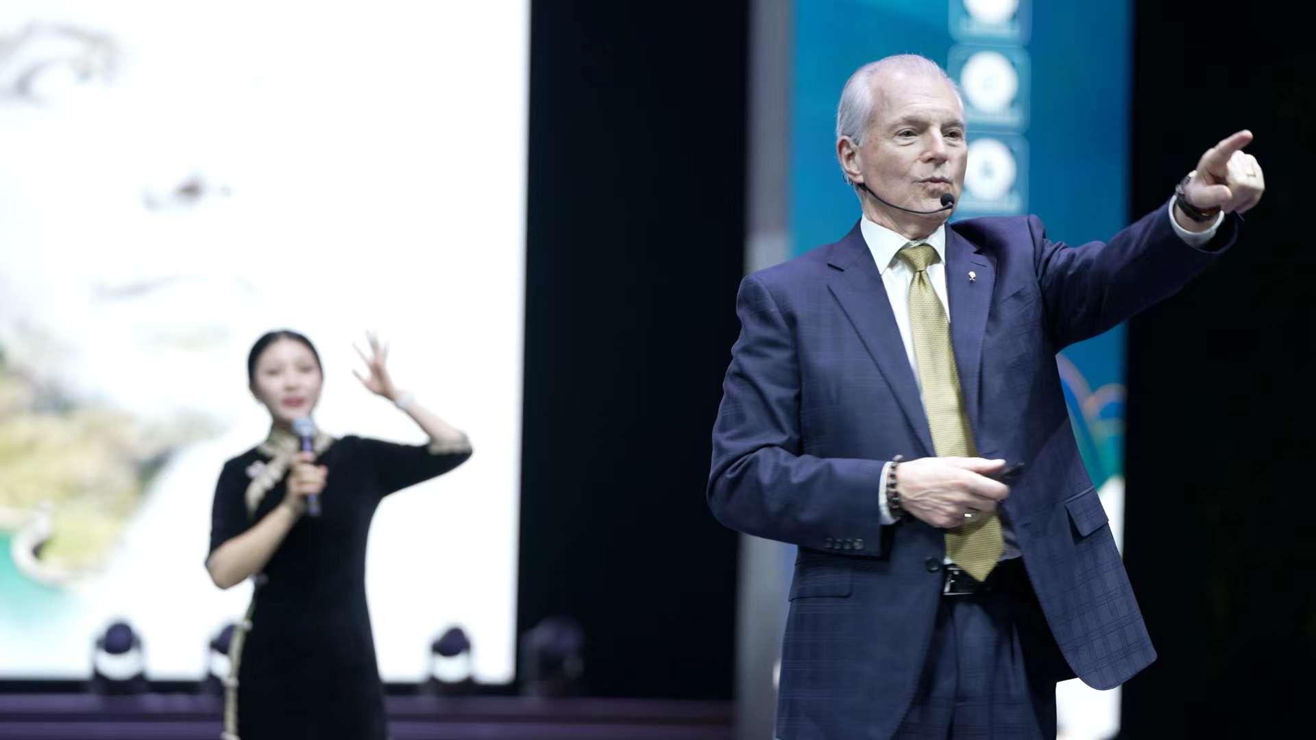 Jim Cathcart on stage at a China event
