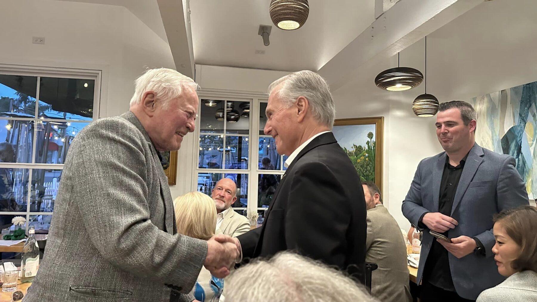 Jim Cathcart greeting a professional